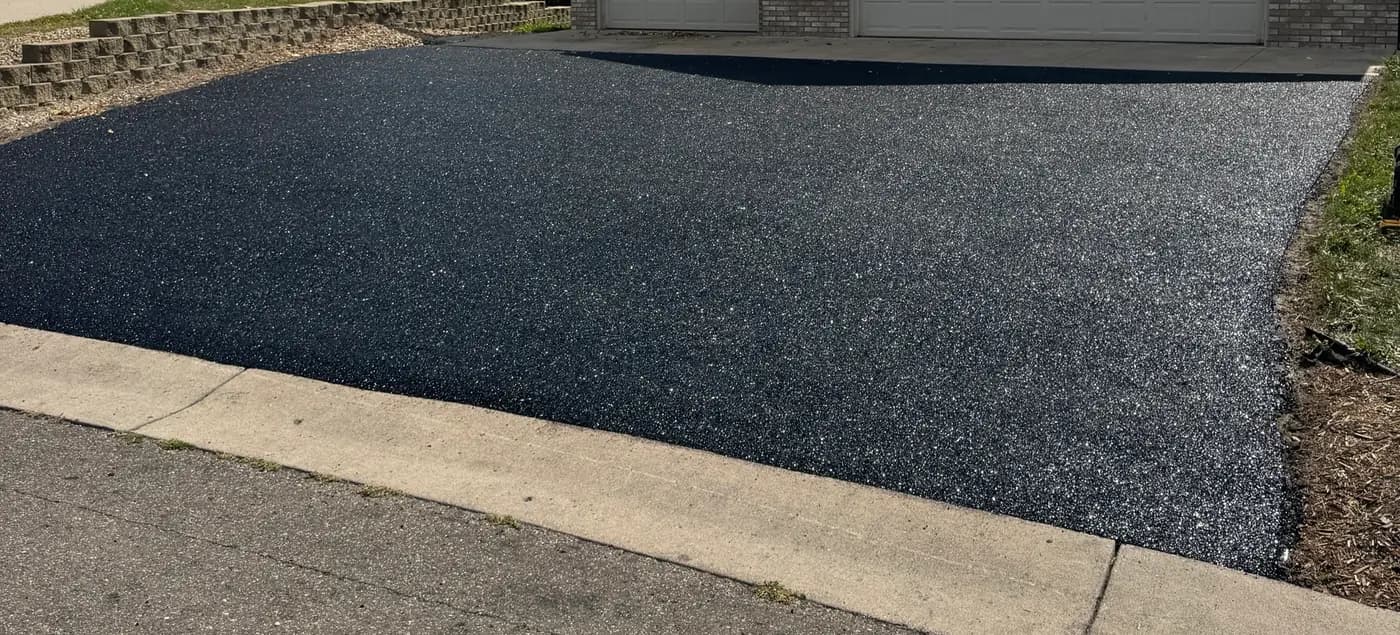 Black RevaFlex Paving driveway installed by WAMS over an existing driveway
