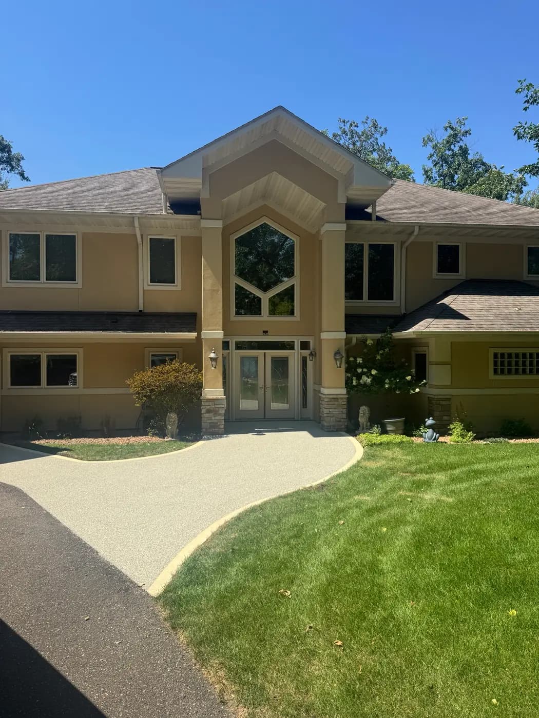 Curved light RevaFlex walkway leading to a front entry, installed by WAMS